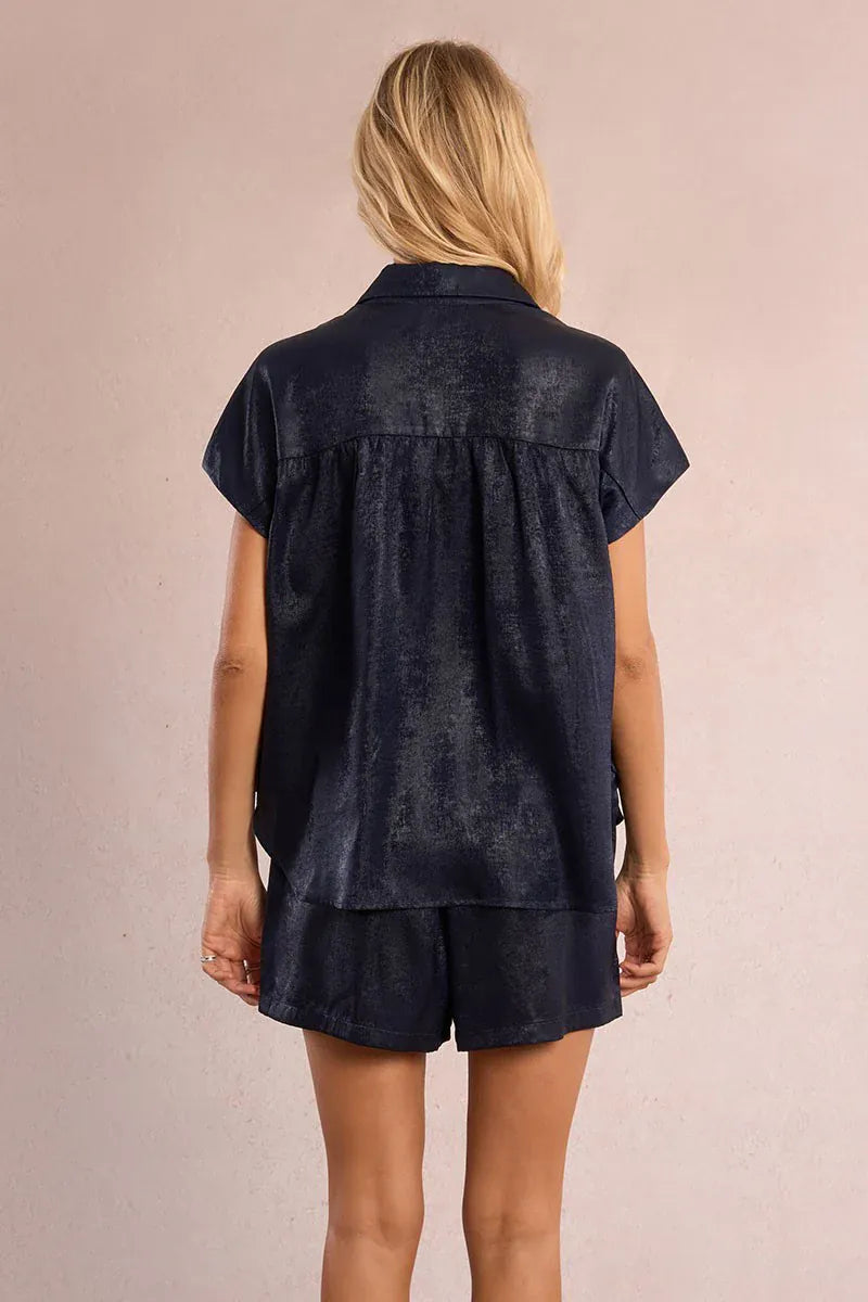 Le Soir par Molly Bracken Camila satin top, stylish sleeveless blouse in smooth satin fabric, shown on a hanger.