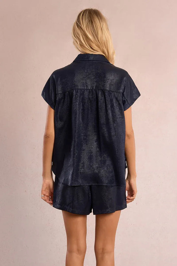 Le Soir par Molly Bracken Camila satin top, stylish sleeveless blouse in smooth satin fabric, shown on a hanger.