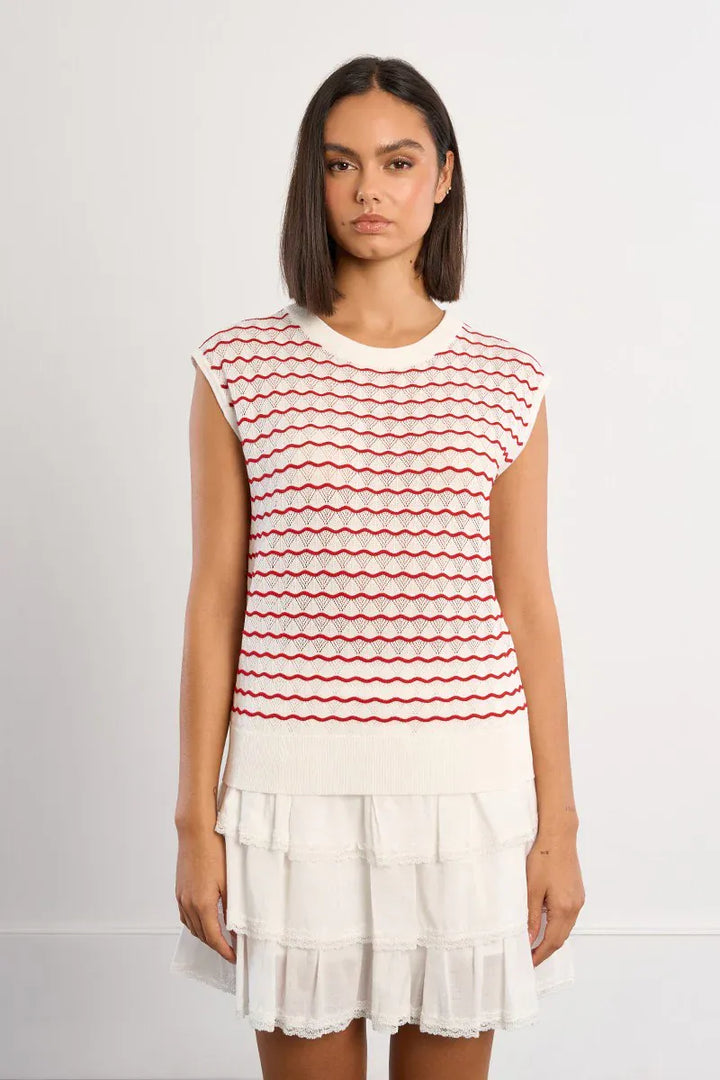 Lili Sidonio Elsie striped sweater top with long sleeves and a relaxed fit, featuring colorful horizontal stripe pattern.