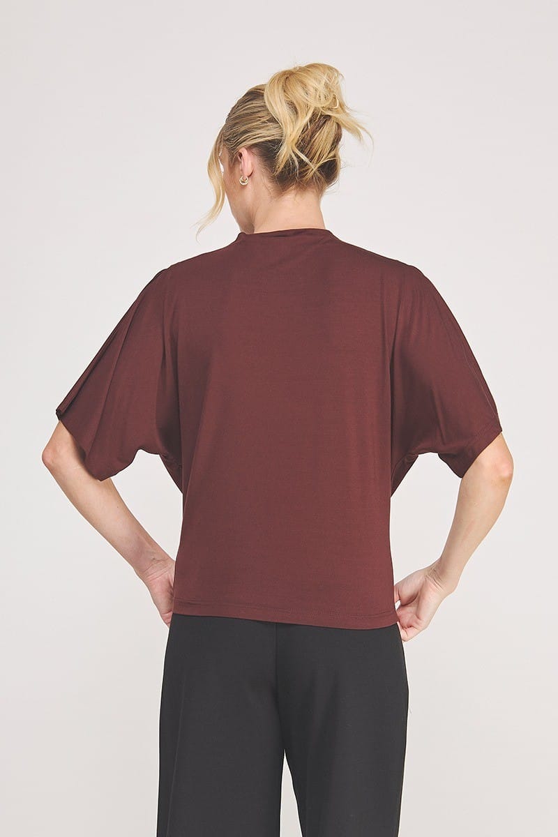 Allie Rose Adley Mock Neck Top, lightweight fabric, fitted design, in a solid color, shown on a model.