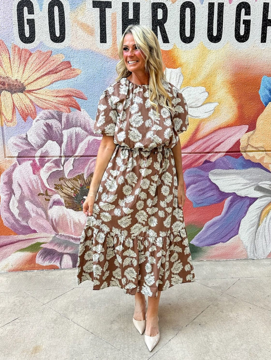 Aureum Ellie Ruffle Midi Skirt displayed on a hanger with soft fabric and ruffle detailing, stylish midi skirt for women.