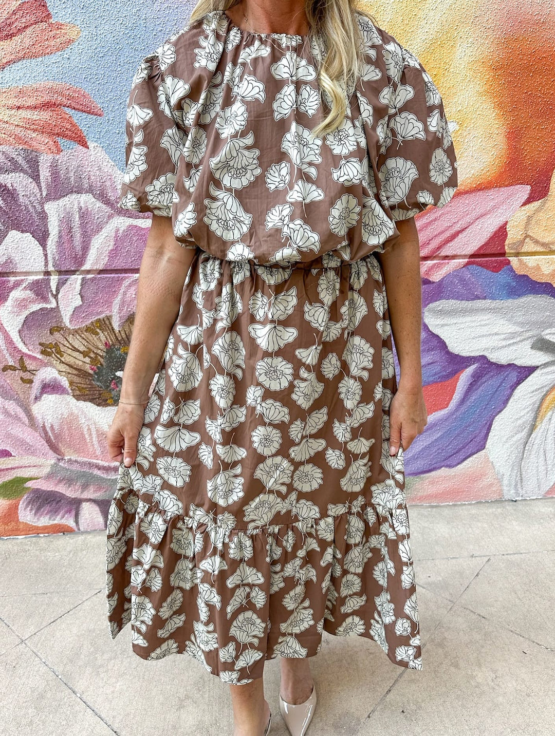Aureum Ellie Ruffle Midi Skirt in flowing fabric with layered ruffle details, styled for a chic, feminine look.