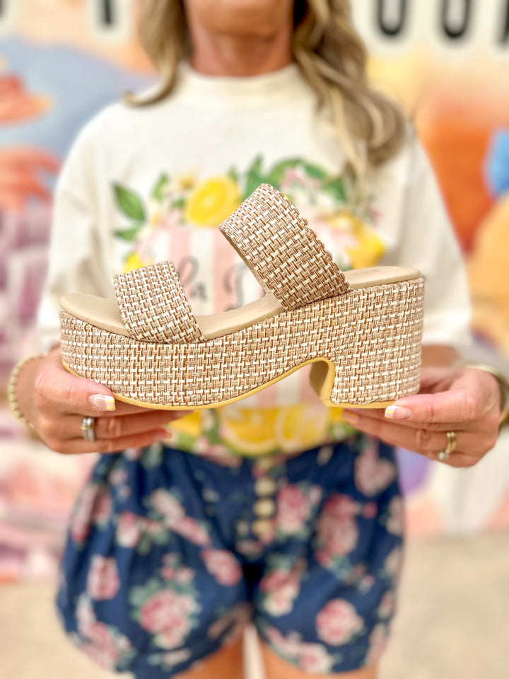Beach by Matisse Ocean Ave Platform Sandal showing a tan platform sandal with a woven strap design on a neutral background.