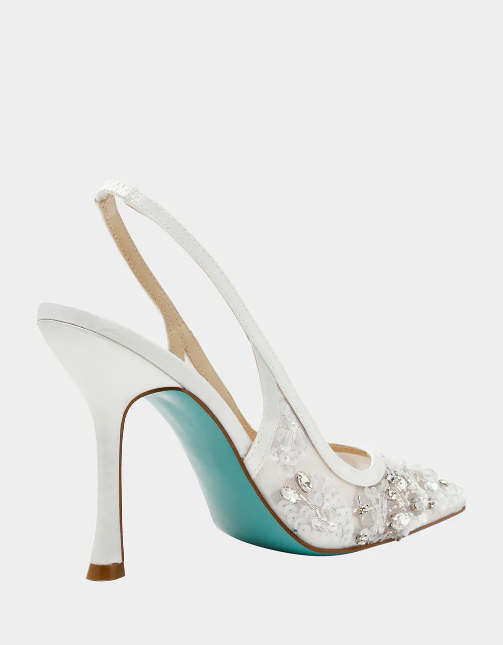 Betsey Johnson Eddie Slingback sandals featuring a stylish design with open toes and adjustable ankle straps.