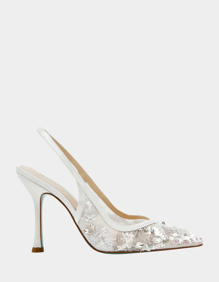 Betsey Johnson Eddie slingback sandal with a pointed toe and ankle strap, featuring stylish black leather material.