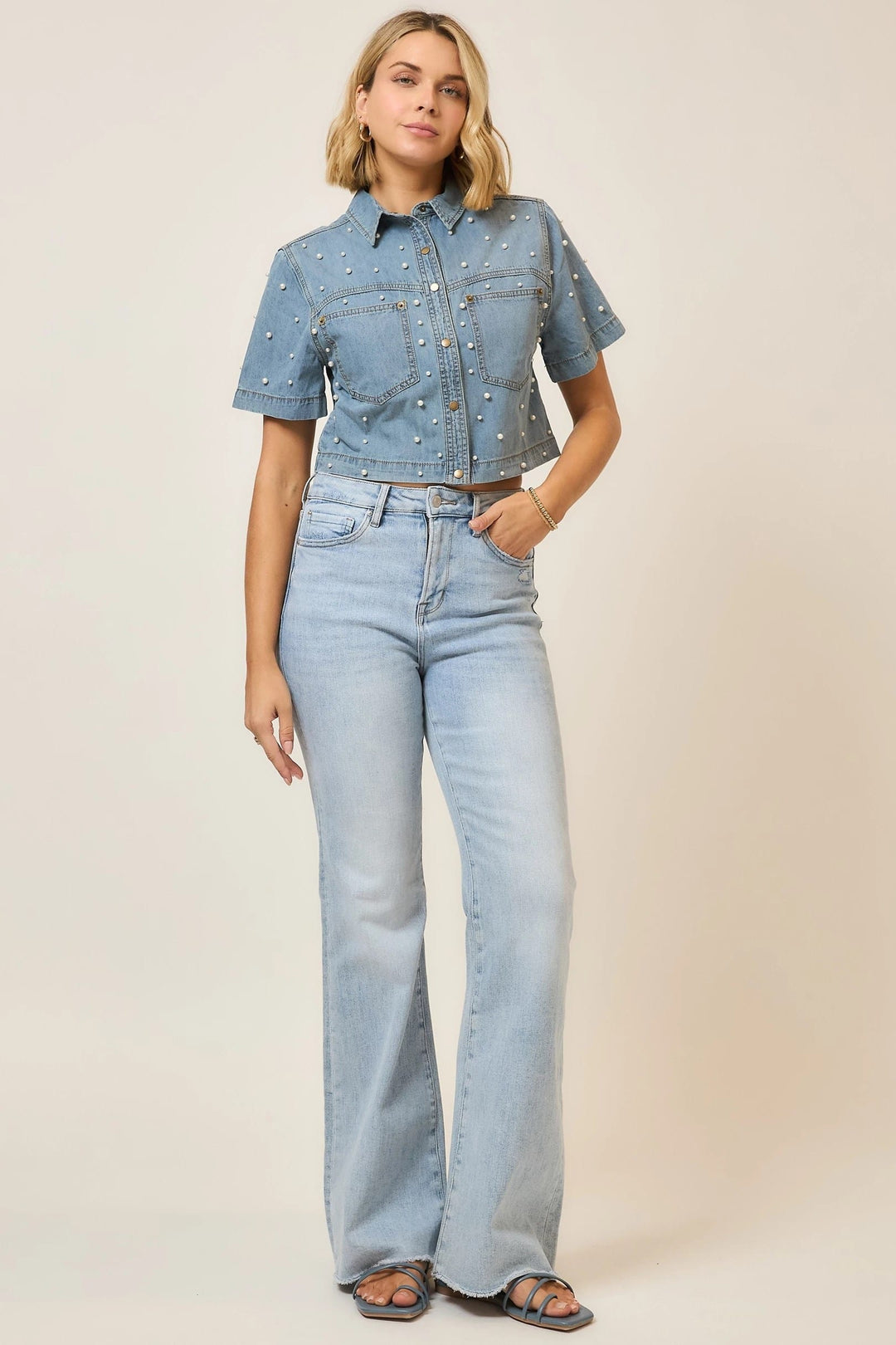 Cozy Co. Callie Pearl Studded Top featuring a stylish sleeveless design with pearl embellishments on the front.