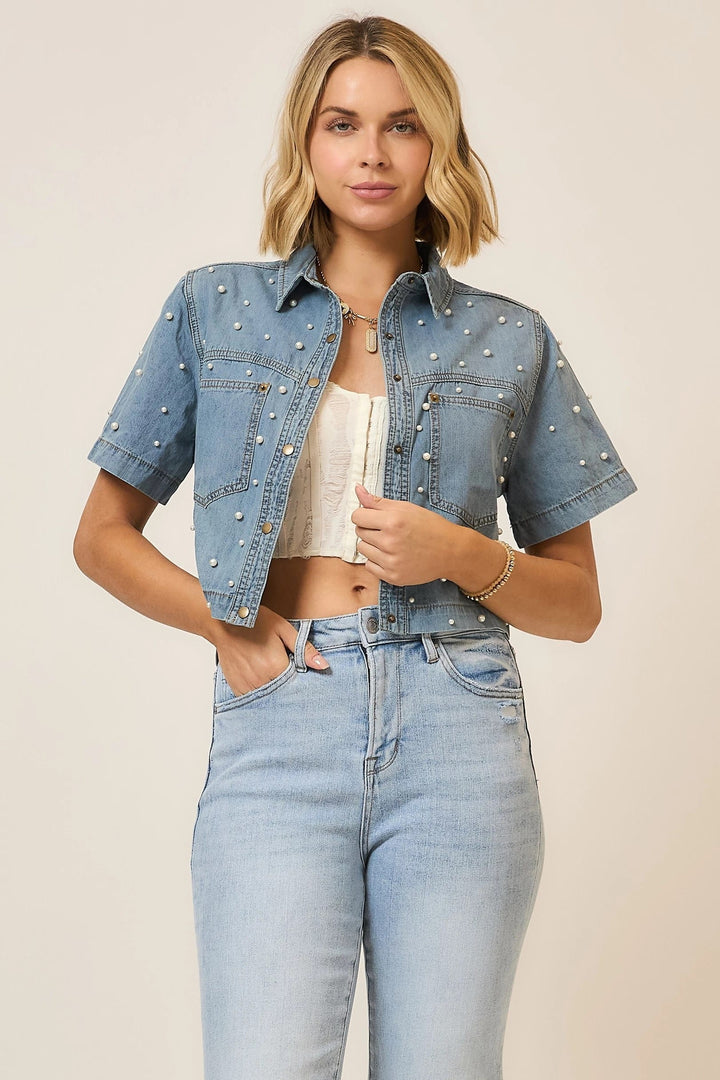 Light denim Callie Pearl Studded Top by Cozy Co., featuring pearl embellishments and a stylish, casual design.