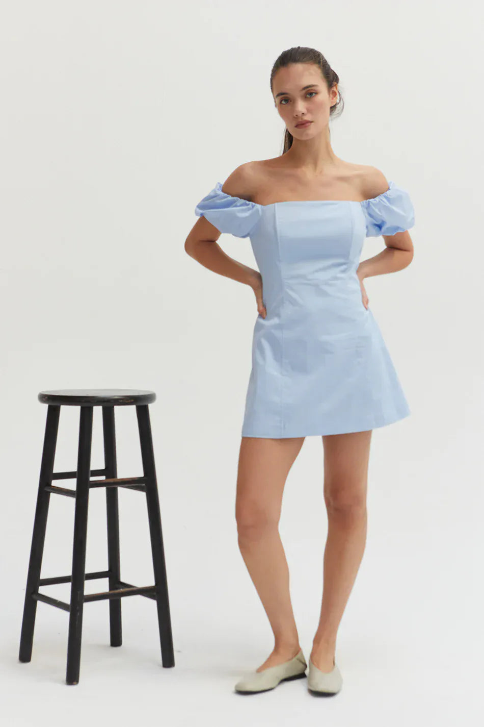 Crescent Abigail Mini Dress showing a stylish sleeveless design with a fitted waist and above-knee hem in soft fabric.