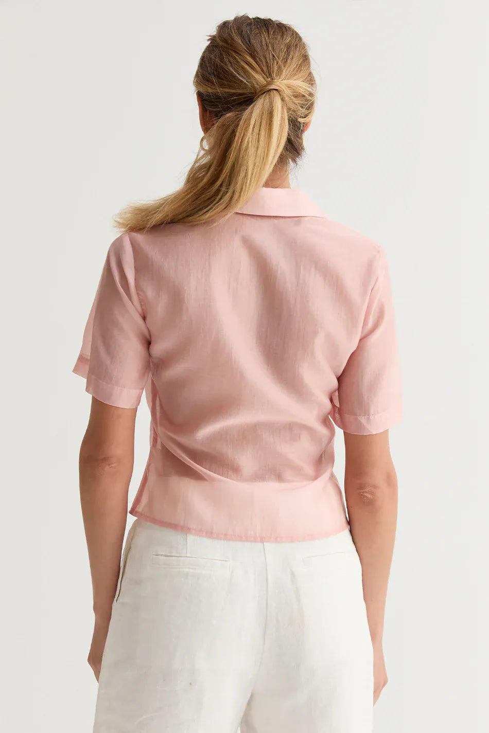Crescent Lola Tencel button-up top in soft, lightweight fabric featuring a classic collar and front buttons, styled on a hanger.