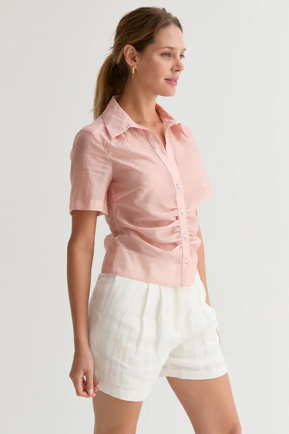 Crescent Lola Tencel button-up top in soft blue with long sleeves and a collared neckline, displayed on a hanger.