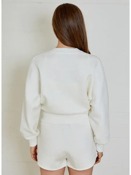 Design History New York Caitlyn Cardigan in soft knit, featuring button closure and a cozy, stylish fit.