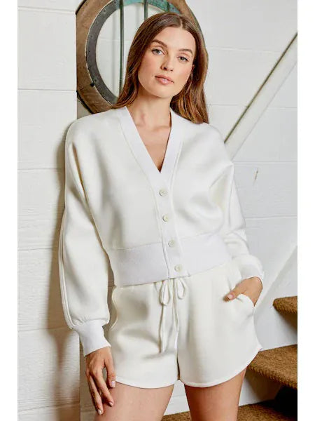 Caitlyn cardigan by Design History New York, beige knit cardigan with front buttons and ribbed cuffs, casual and stylish.