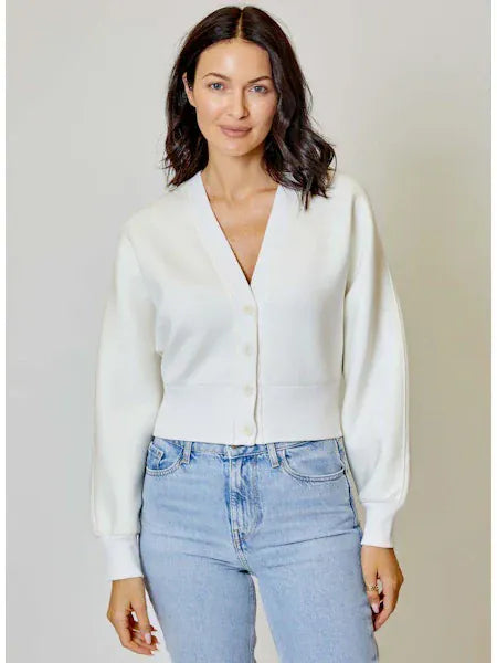 White Caitlyn Cardigan by Design History New York, lightweight knit with long sleeves and button closure.