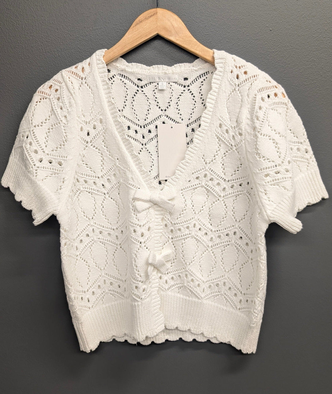 Eliana V-Neck Bow Sweater by Design History New York, soft knit sweater with V-neck and bow detail, in a cozy, stylish design.