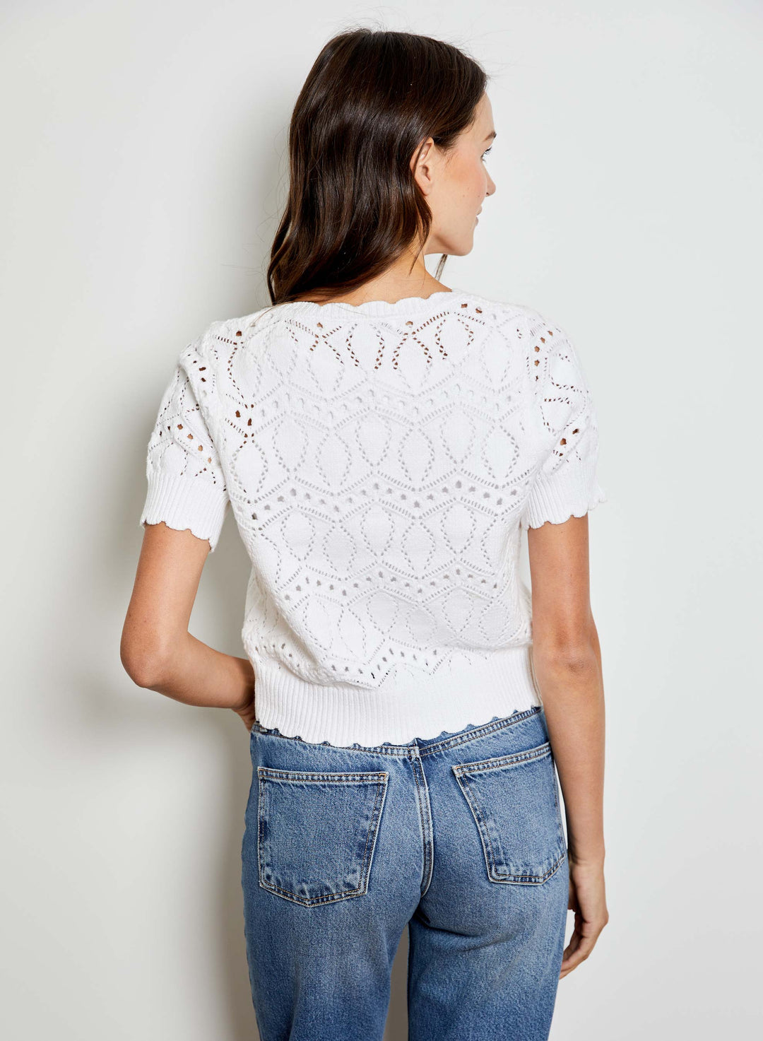 Eliana V-Neck Bow Sweater by Design History New York, featuring a stylish V-neck and bow detail in soft knit fabric.