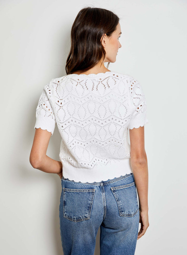 Eliana V-Neck Bow Sweater by Design History New York, featuring a stylish V-neck and bow detail in soft knit fabric.