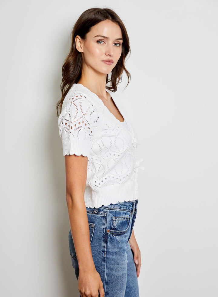 Eliana V-Neck Bow Sweater by Design History New York, featuring a V-neck design and bow detail in soft knit fabric.