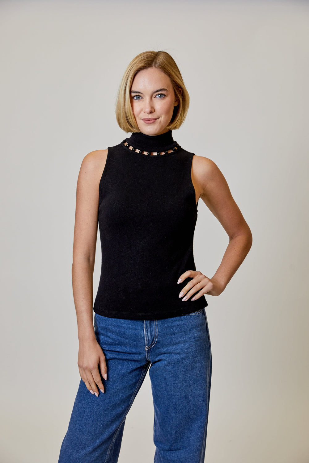 Design History New York Alora Pearl Mock Neck Top, close-up of the stylish knit top with a mock neckline and pearl accents.