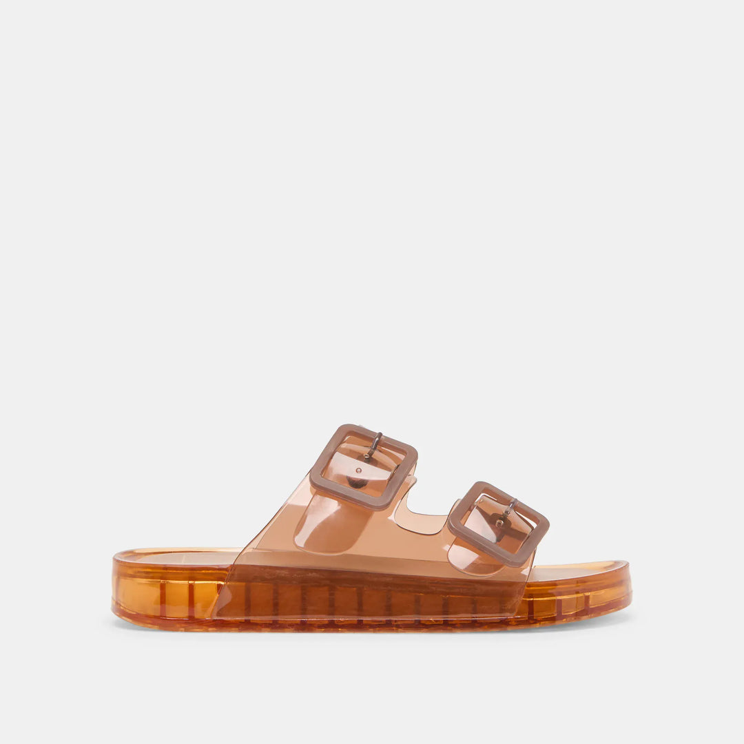 Dolce Vita Julio sandals featuring strappy design and flat sole, shown in natural tan color on a neutral background.