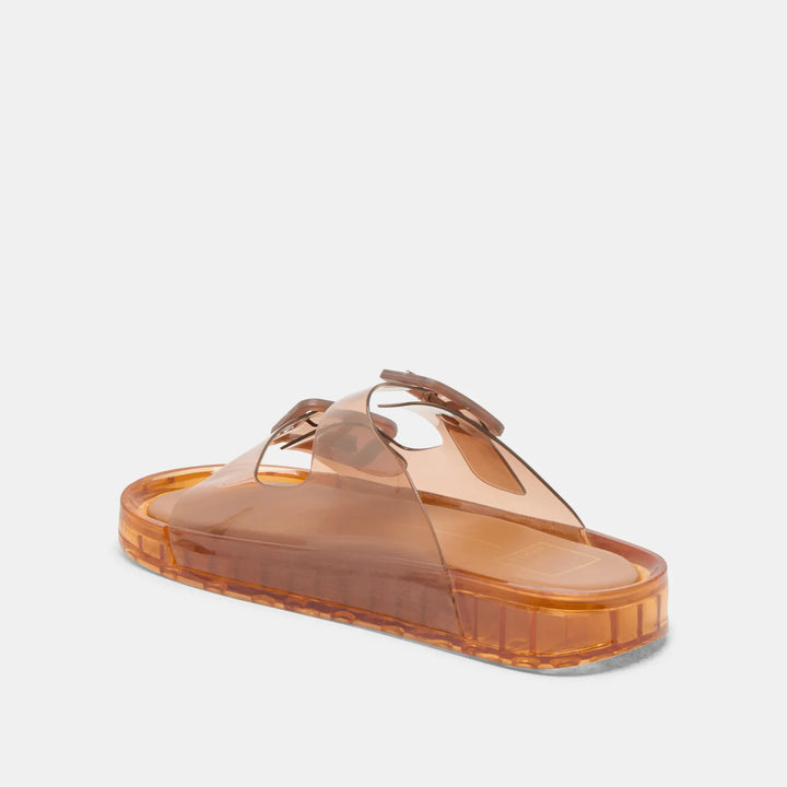 Dolce Vita Julio sandals featuring tan leather straps and flat sole, stylish open-toe design for casual summer wear.