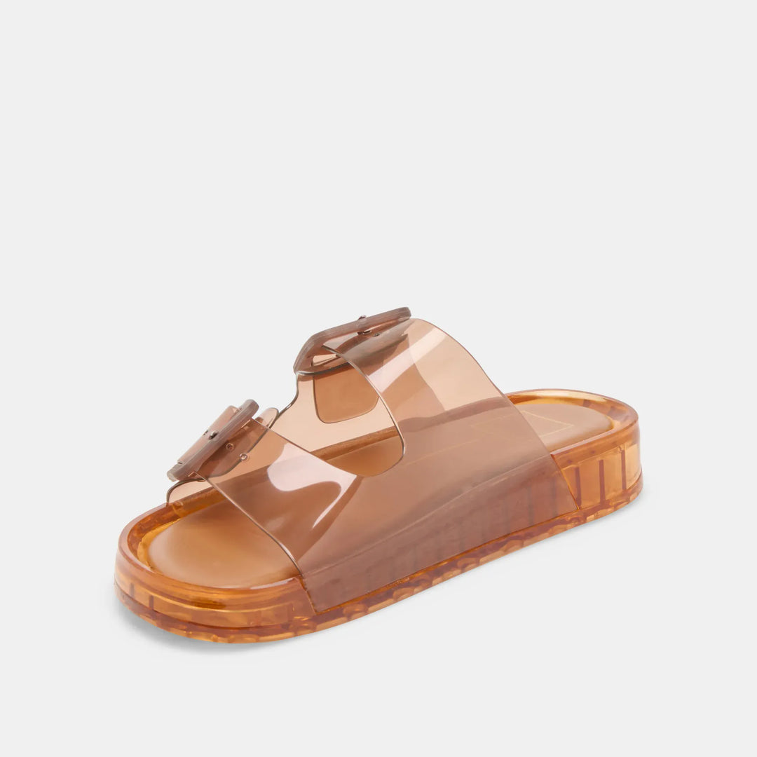 Dolce Vita Julio sandals featuring tan leather straps and flat sole, stylish open-toe design for casual summer wear.