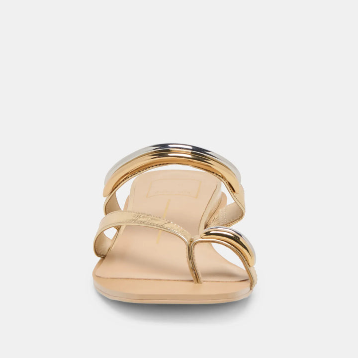 Dolce Vita Tarina Sandals featuring tan leather straps and ankle buckle, open-toe design, and flat sole.
