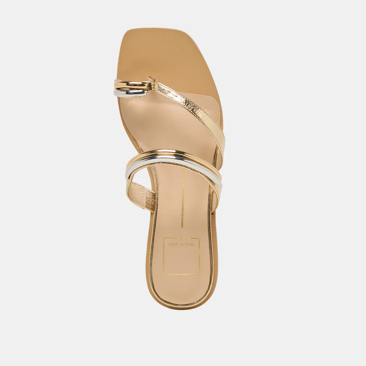 Dolce Vita Tarina Sandals with tan leather straps and flat sole, featuring a stylish open-toe design.