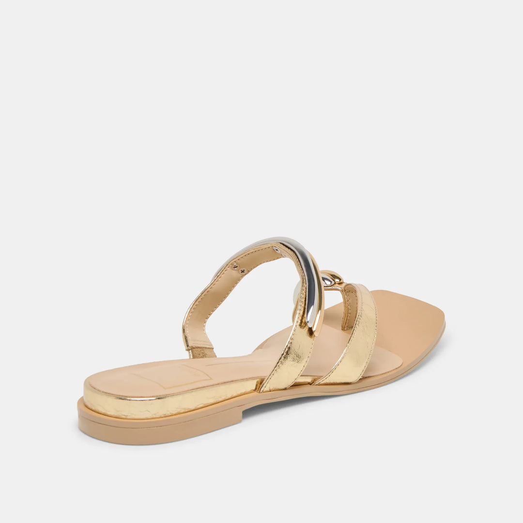 Dolce Vita Tarina Sandals featuring tan leather straps and flat soles, perfect for casual summer wear.