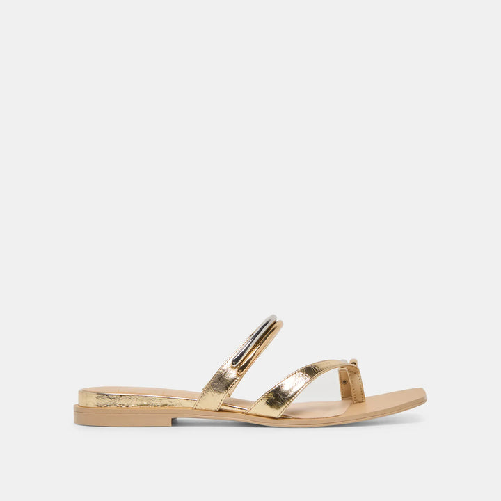 Dolce Vita Tarina Sandals featuring a strappy design and flat sole, styled in neutral tones for casual summer wear.