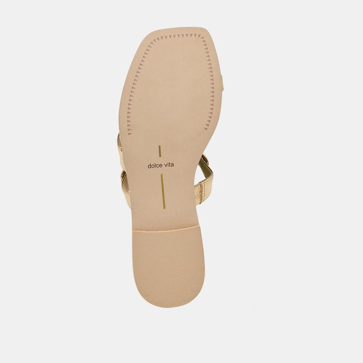 Dolce Vita Tarina sandals with strappy design and flat sole, beige-colored footwear for casual summer wear.