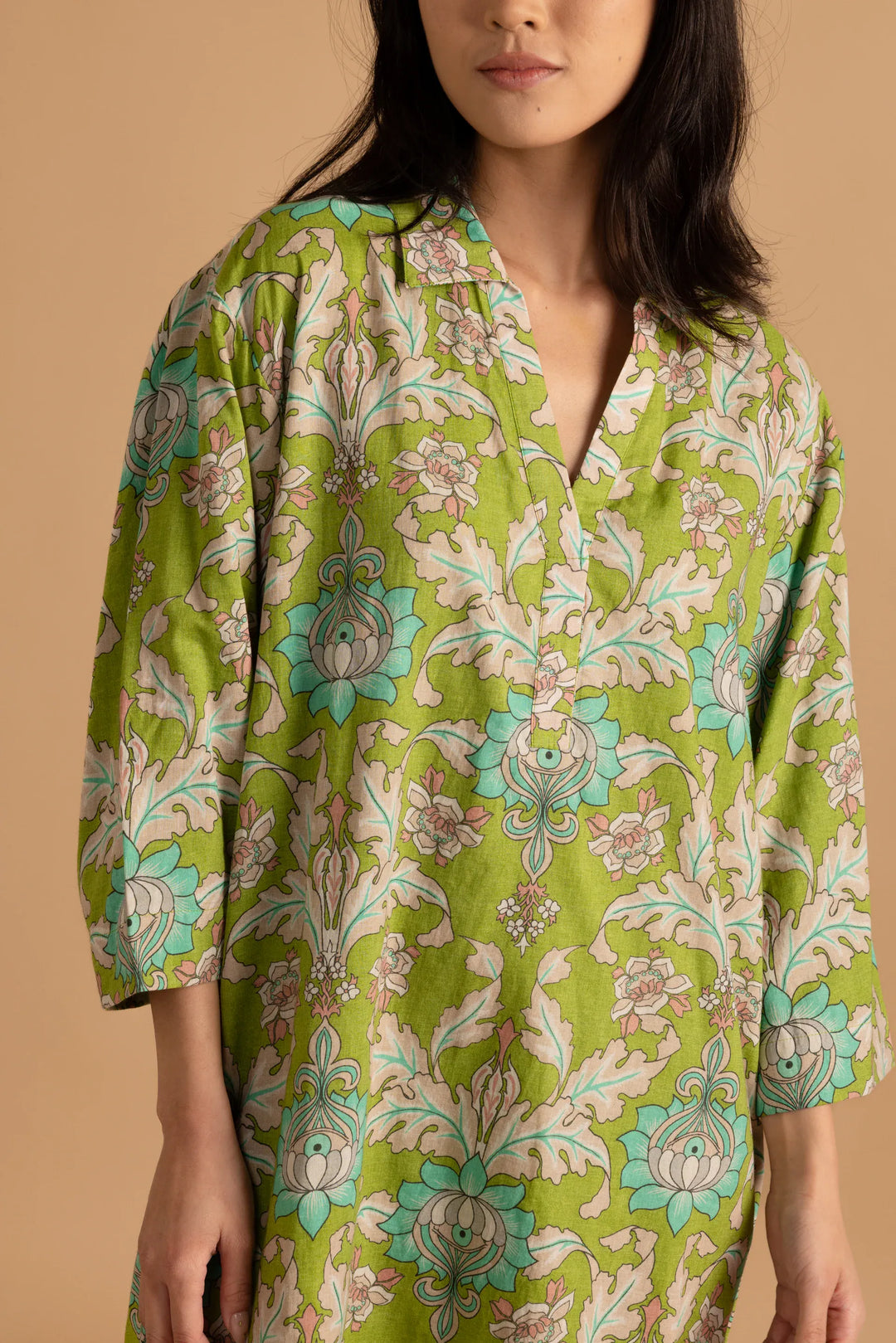 Double A Colette Mini Dress shown in a stylish, fitted design with a vibrant pattern and short sleeves.