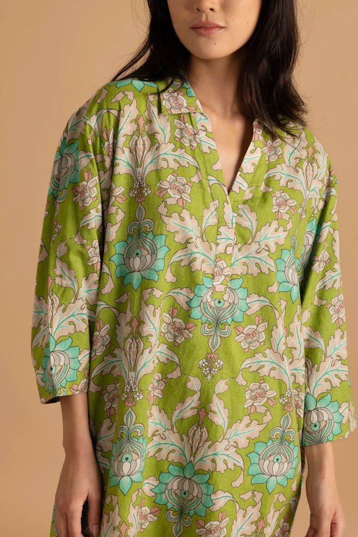 Double A Colette Mini Dress shown in a stylish, fitted design with a vibrant pattern and short sleeves.