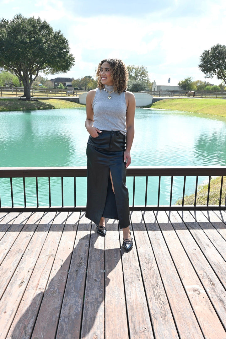 Elan Alice Midi Slit Skirt displayed on a model, featuring a sleek design and side slit, perfect for stylish everyday wear.