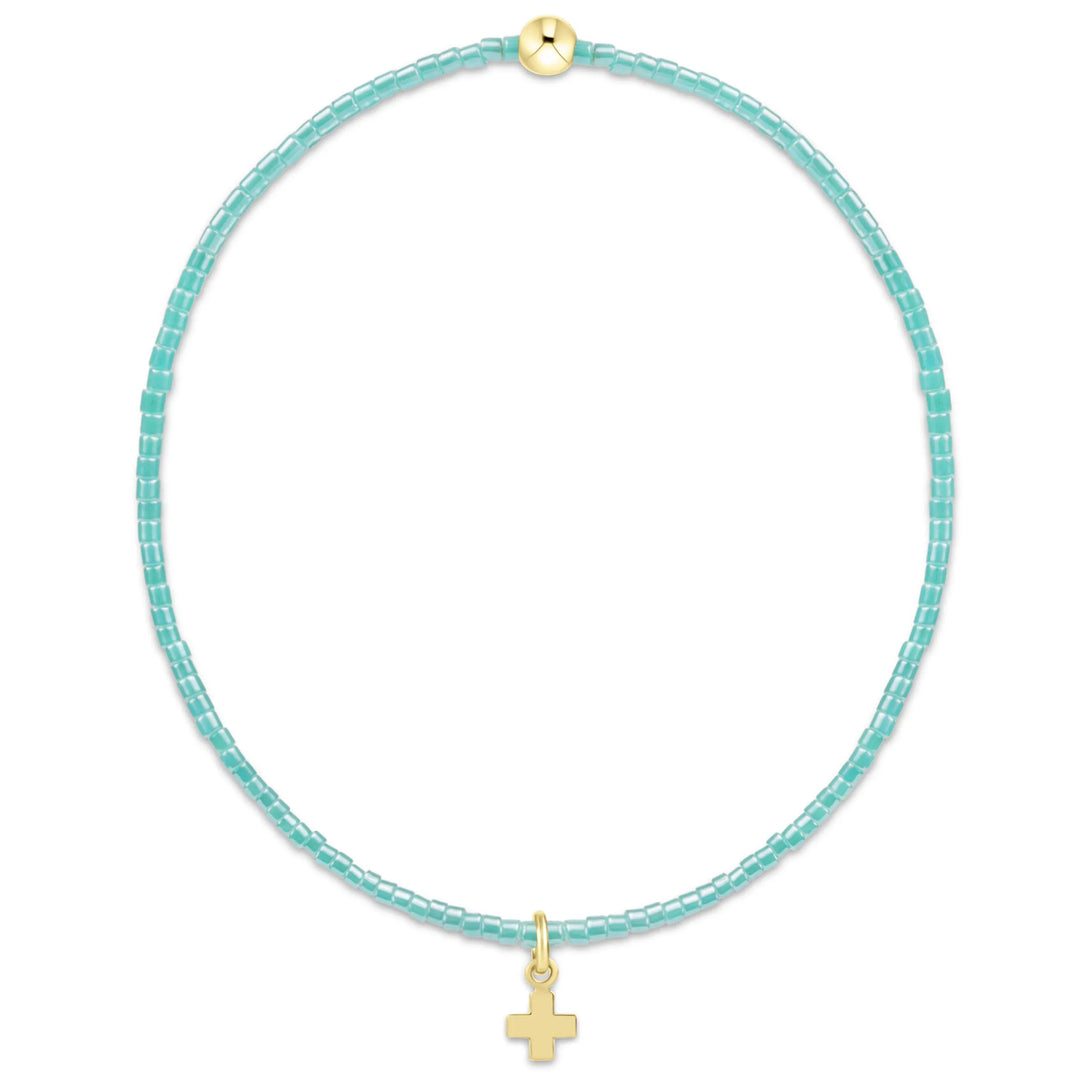 Enewton Hope Classic Sea Glass Bracelet with signature cross small gold charm, showcasing hand-polished sea glass beads and delicate jewelry design.