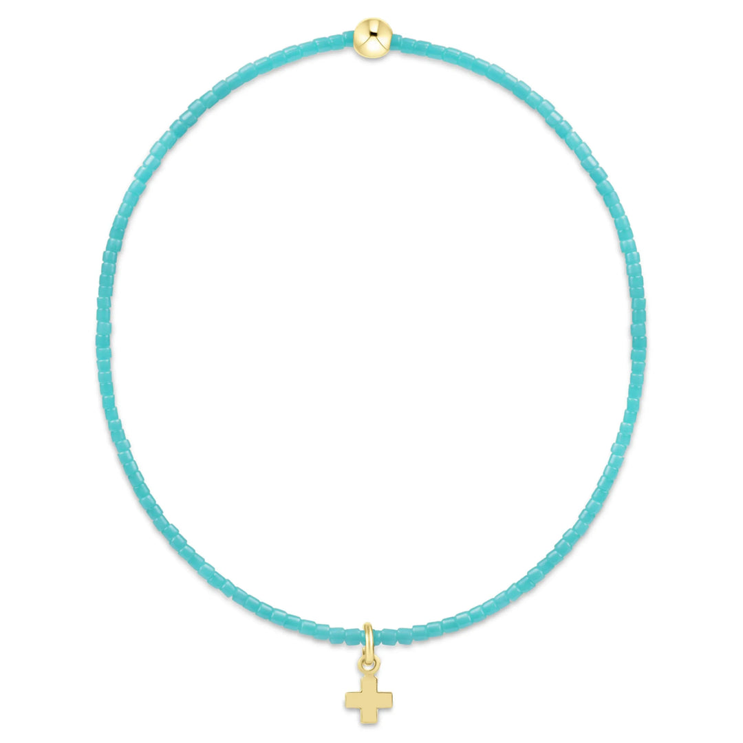 Enewton Hope Classic Turquoise Bracelet with a small gold signature cross charm, stylish jewelry accessory for women.