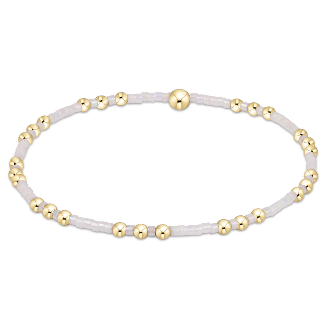 Enewton Hope Joy bracelet in silky white, showcasing a delicate, elegant bracelet with a minimalist design and subtle branding.
