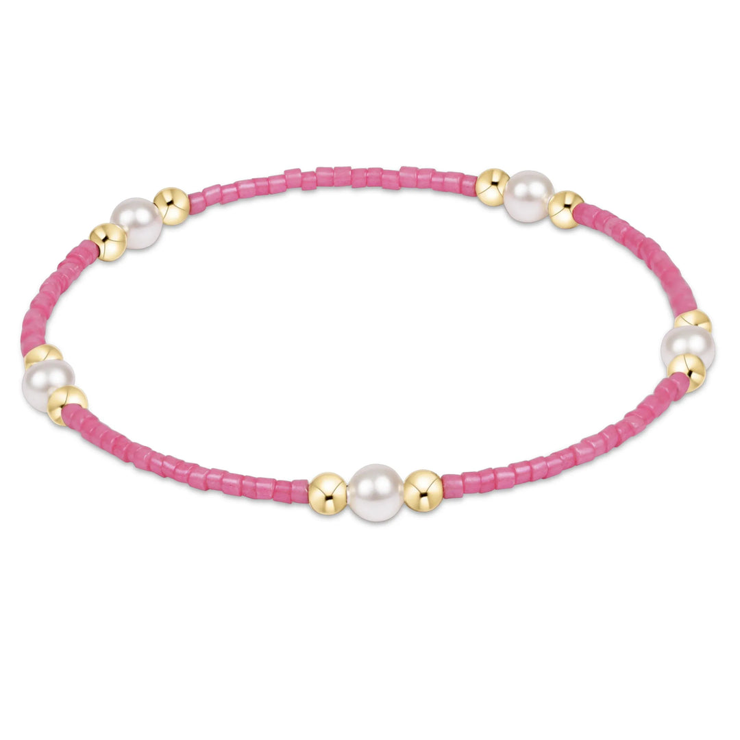 Enewton Hope Purpose Pearl Bracelet in bubblegum pink with lustrous pearls and a delicate chain, designed for elegant wristwear.