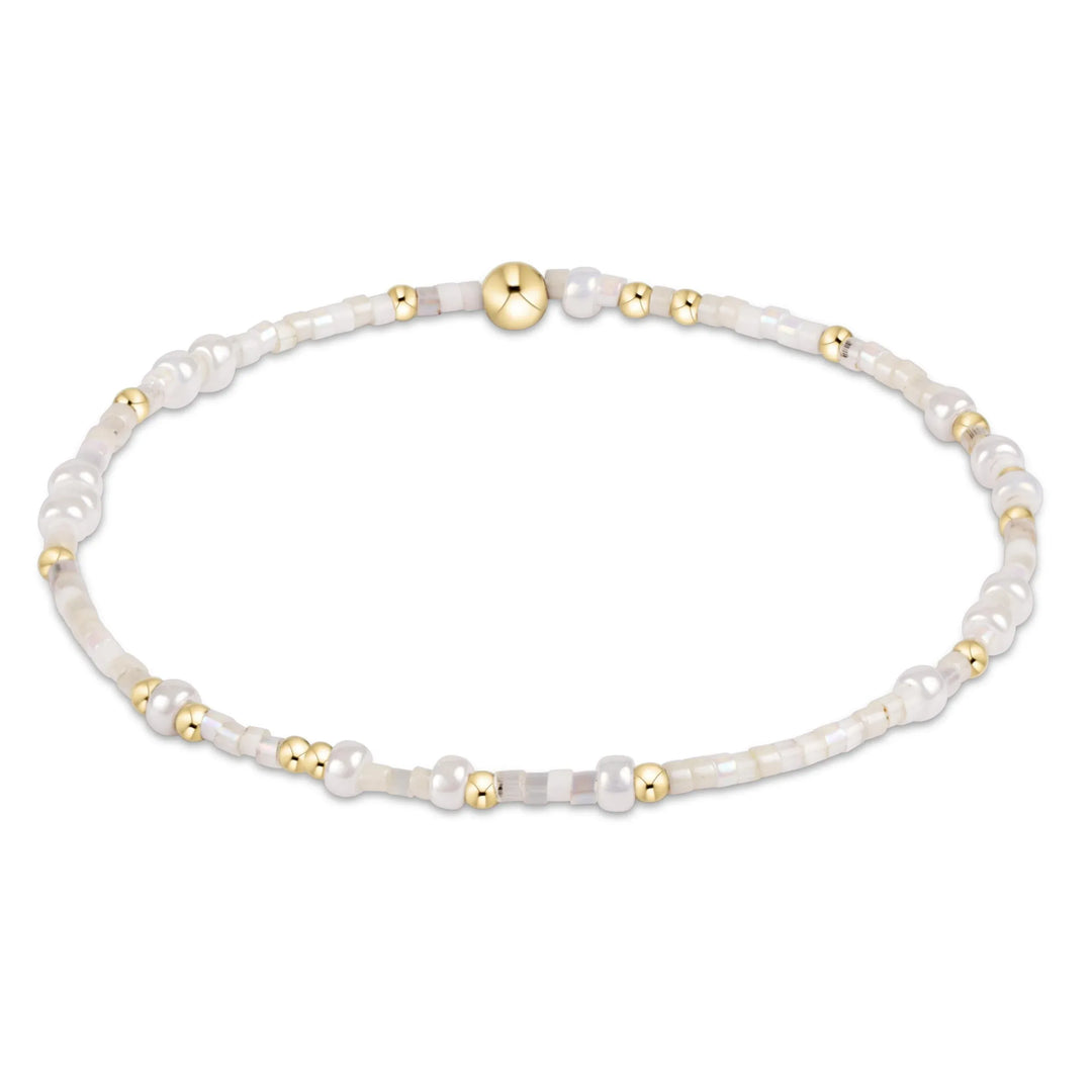 Enewton Hope Unwritten bracelet with shell charm, featuring a delicate design and adjustable bracelet band.
