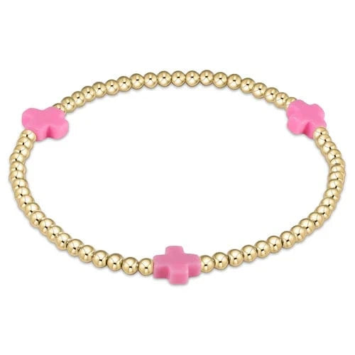 Bright pink enewton Signature Cross 3mm gold beaded bracelet with cross pattern, stylish and elegant jewelry accessory.