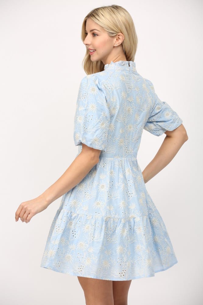 Fate Layla Broderie Mini Dress featuring intricate embroidery and a feminine silhouette, displayed on a hanger.