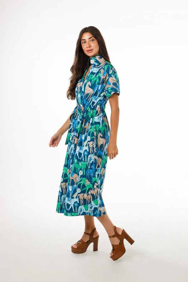 Holly Shae Bria midi dress in a lightweight fabric, displayed in a soft color, with a fitted waist and elegant design.