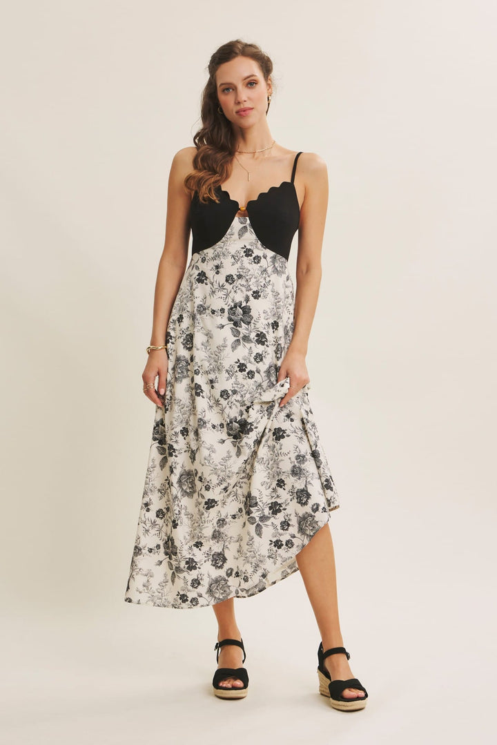 In February scallop cutout contrast midi dress featuring a stylish design with eye-catching details and a fitted silhouette.