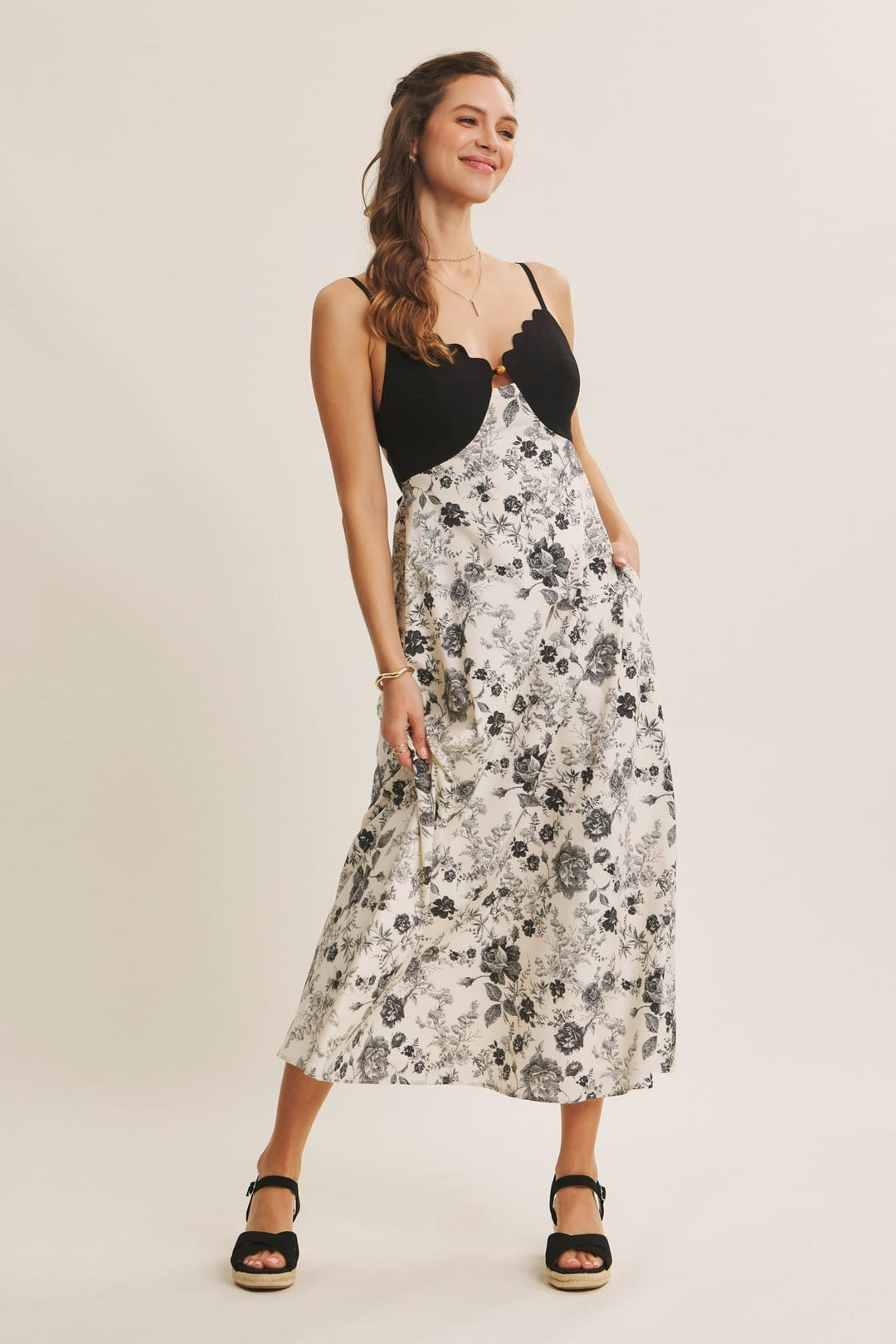 In February midi dress with eye-catching scallop cutout contrast design, stylish and elegant for special occasions.