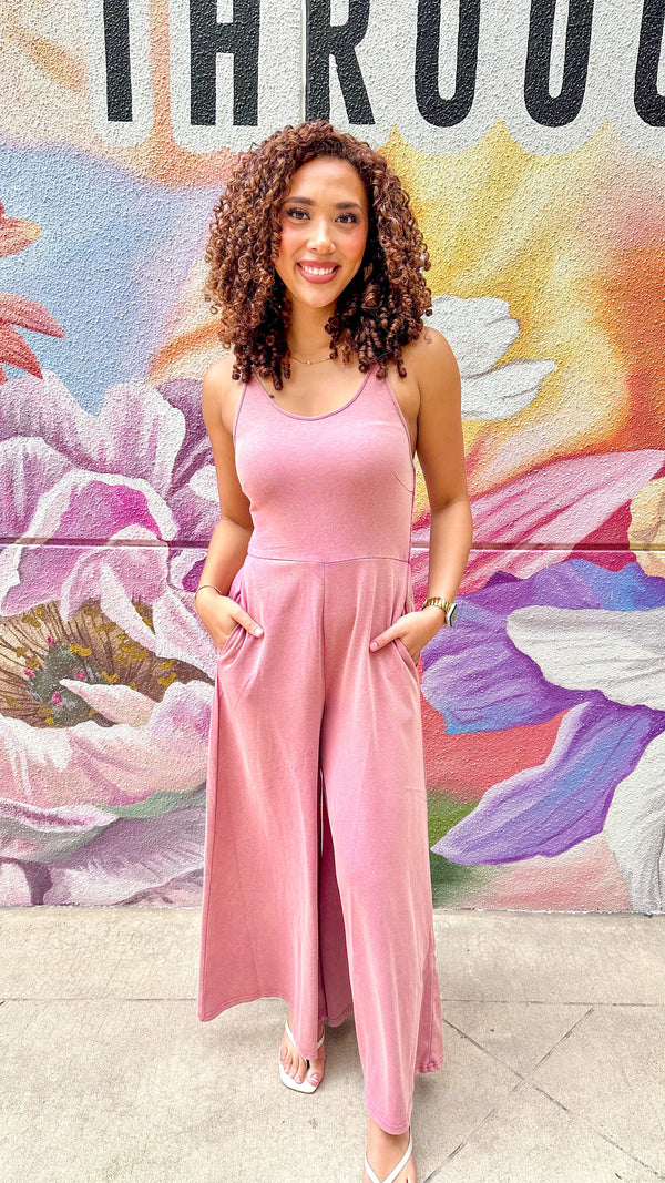 J.NNA Hailey wide-leg jumpsuit displayed on a model, featuring a stylish, flowy design with a fitted waist and wide-leg pants.
