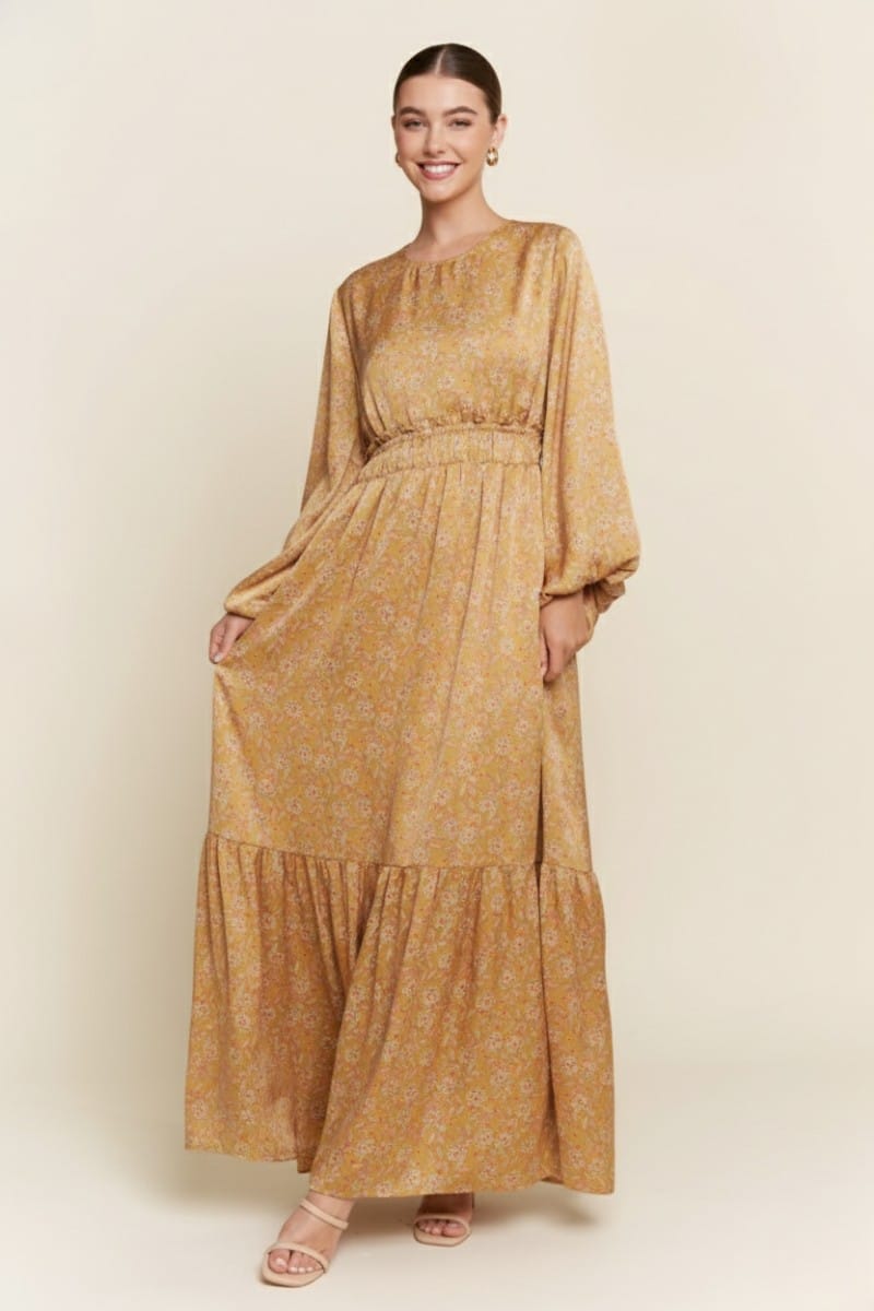 J.NNA Alina Glossy Maxi Dress showing shiny fabric, flowing silhouette, and elegant design for formal or evening wear.