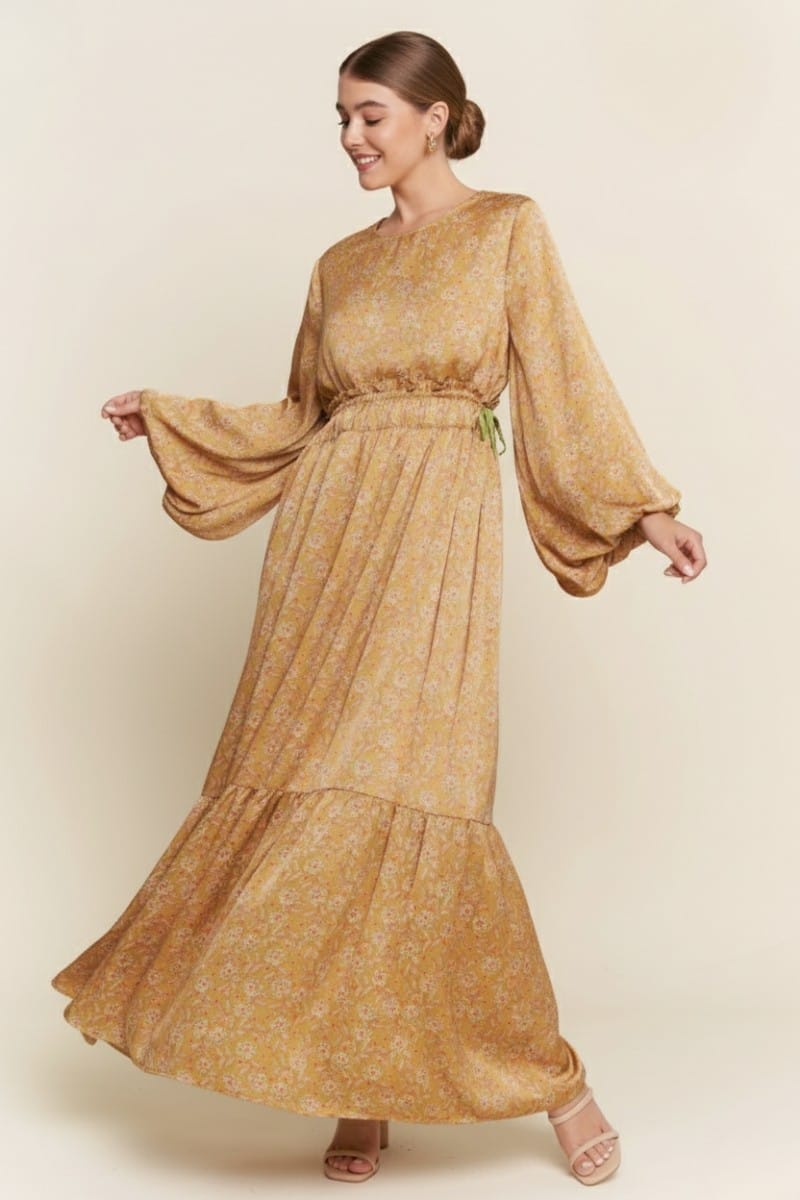 J.NNA Alina Glossy Maxi Dress in golden kiwi color, flowy and elegant maxi dress with shiny, glossy fabric for a sophisticated look.