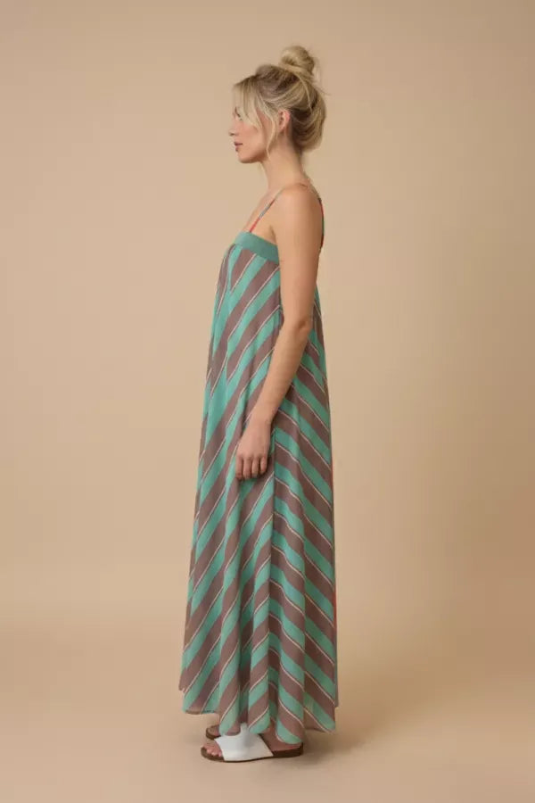 J.NNA Serafina striped maxi dress with flowing fabric and halter neckline, perfect for summer or casual occasions.