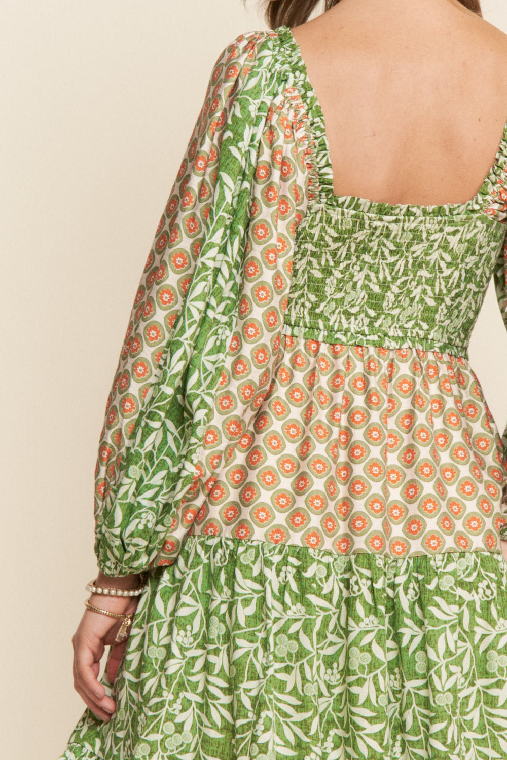 J.NNA Milie Pattern Mini Dress showcasing a stylish mini dress with a colorful, intricate pattern and fitted silhouette.