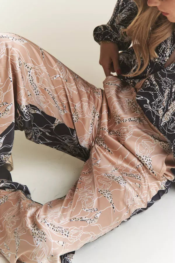 J.NNA Sophie satin multi-color slacks displaying vibrant, flowing fabric and tailored fit on a model.