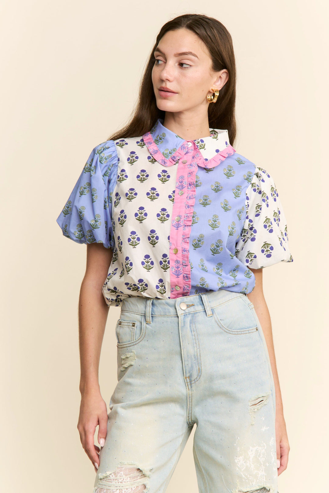 Lavender and blue Cora floral colorblock top by J.NNA, featuring a stylish design with floral patterns and colorblocking.